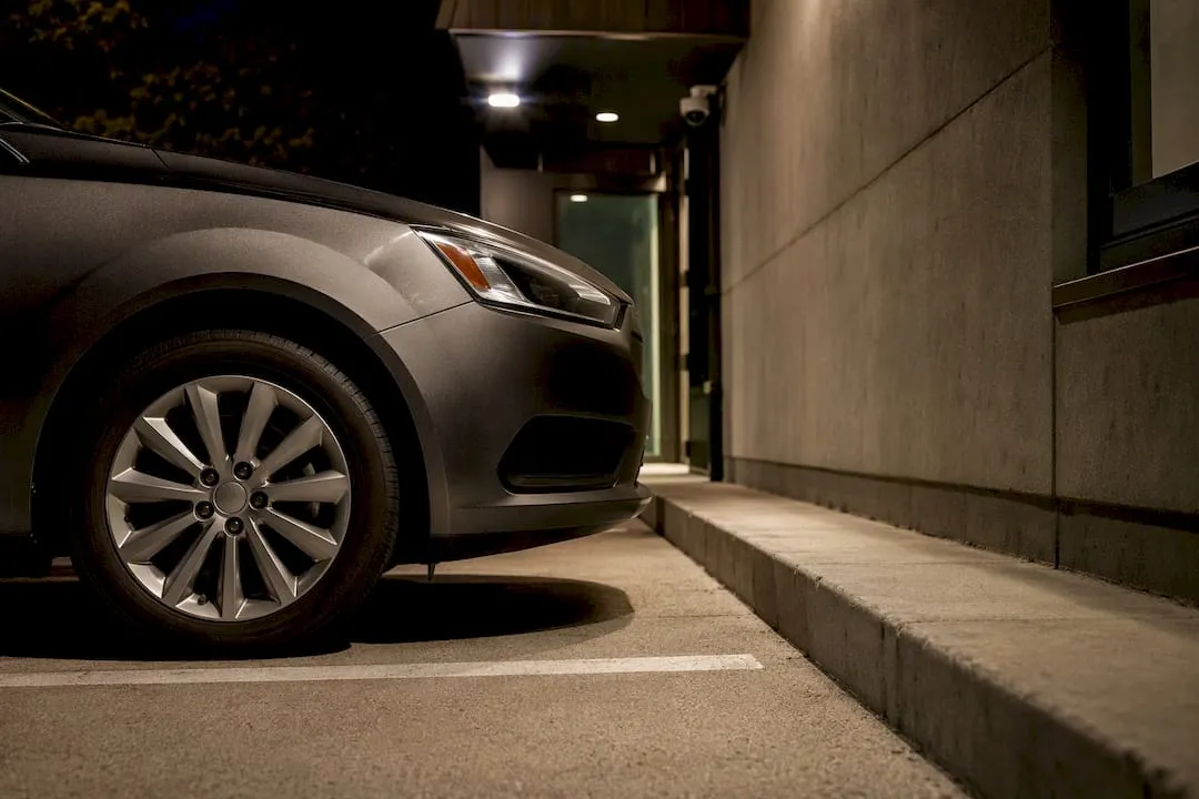 Vehicle parked nose-in under security lighting